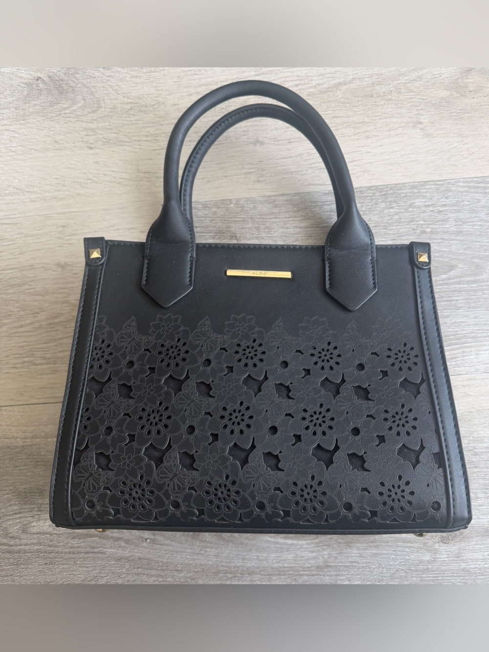 EUC Black Aldo laser cut floral vegan leather handbag tote adjustable crossbody